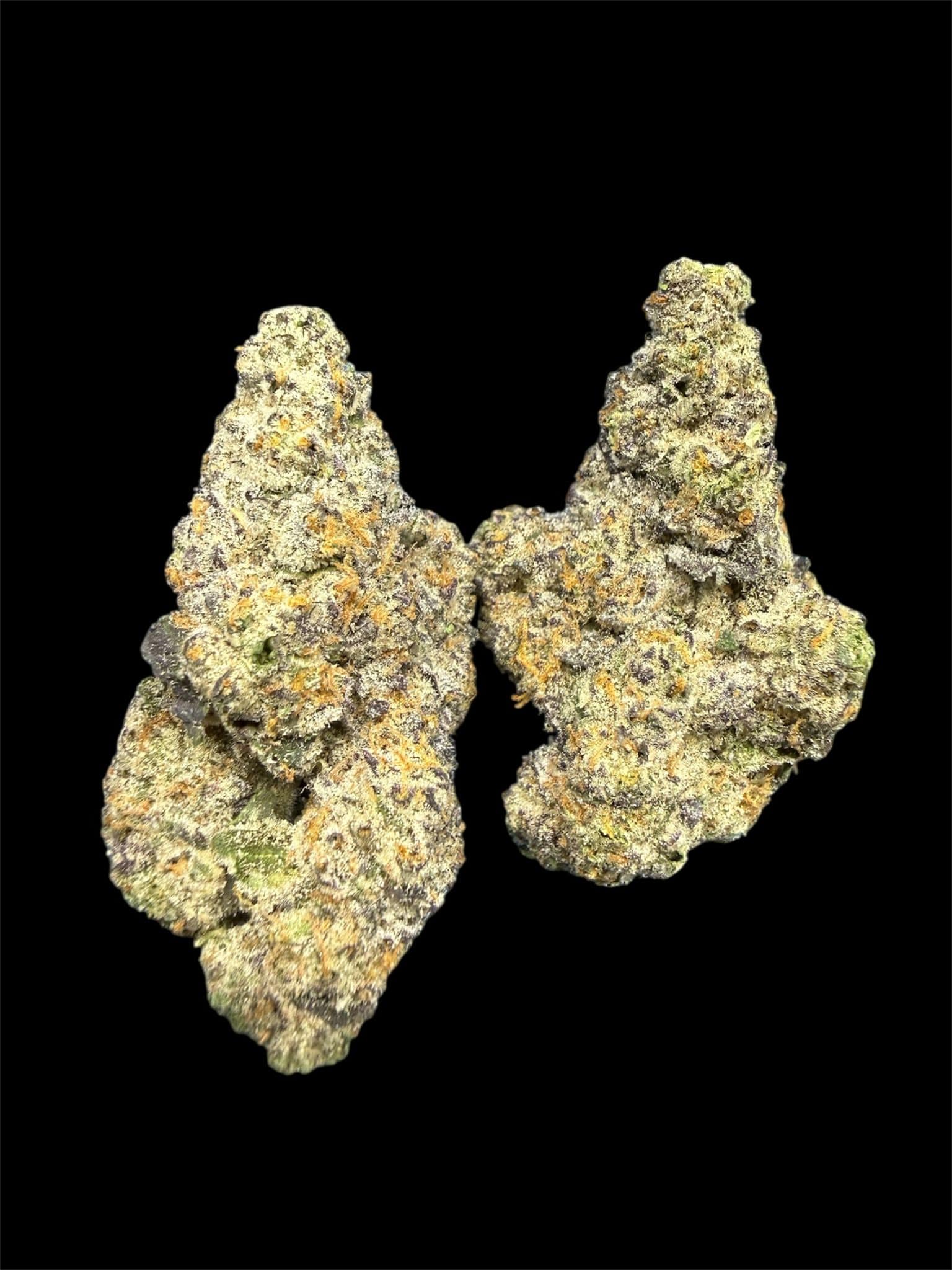 Close-up of high-quality cannabis buds with trichomes on black background.