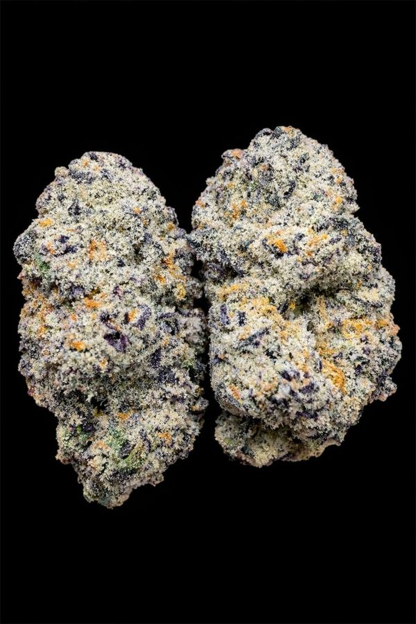 Close-up of high-quality cannabis buds with vibrant trichomes on a black background.